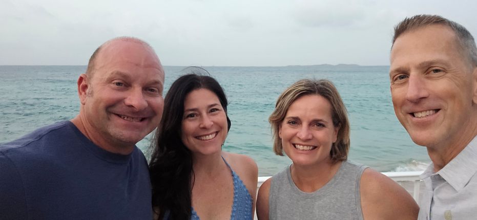 The four of us starting our tropical getaway on the beach in St. Thomas