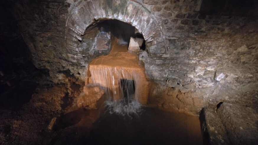 Hot springs overflow inside The Roman Baths